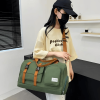 Large capacity travel storage bag with multiple pockets for dry and wet separation, suitable for both handheld and crossbody use