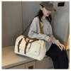 Large capacity travel storage bag with multiple pockets for dry and wet separation, suitable for both handheld and crossbody use